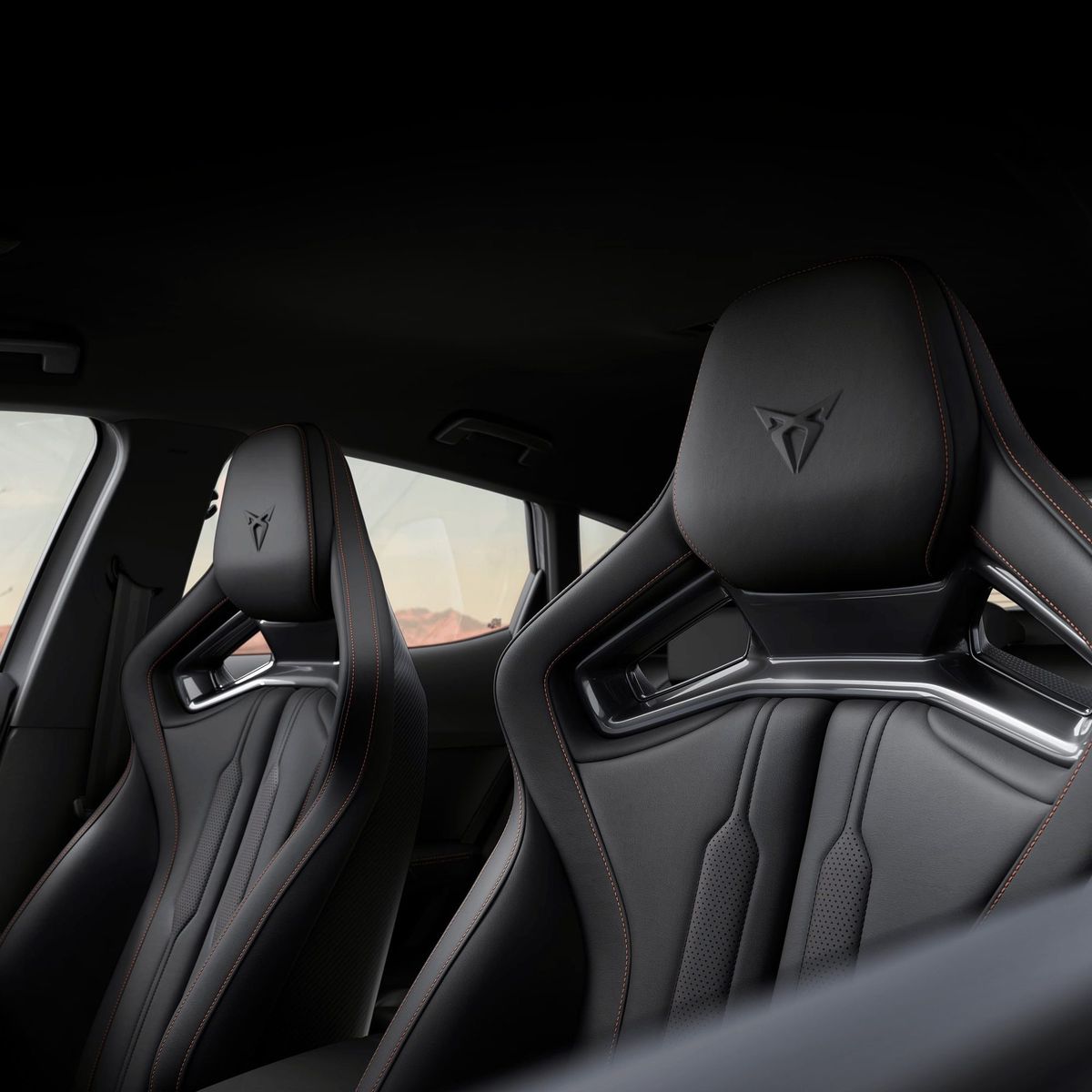 Black bucket sport seats with copper stitching